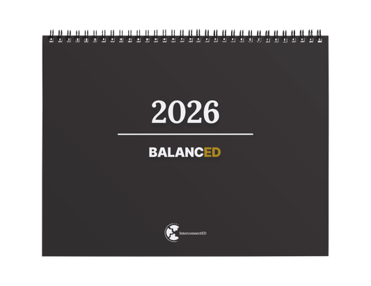 Black spiral-bound calendar for 2026 with 'Balanced' branding on a white background