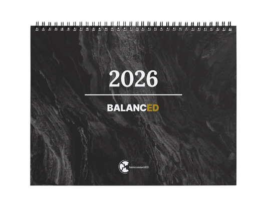 Calendar with '2026 Balanced' text on a textured black background