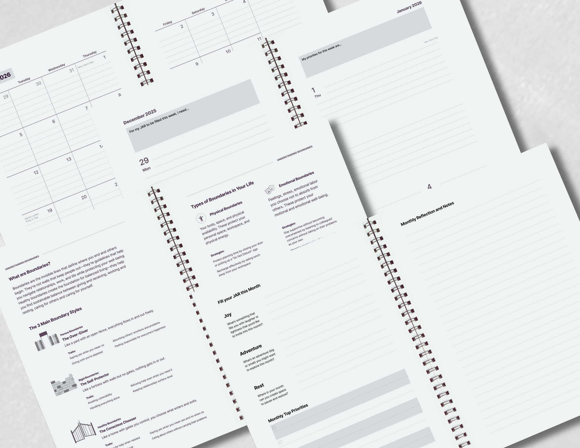Spiral-bound planner with printed pages on a white surface