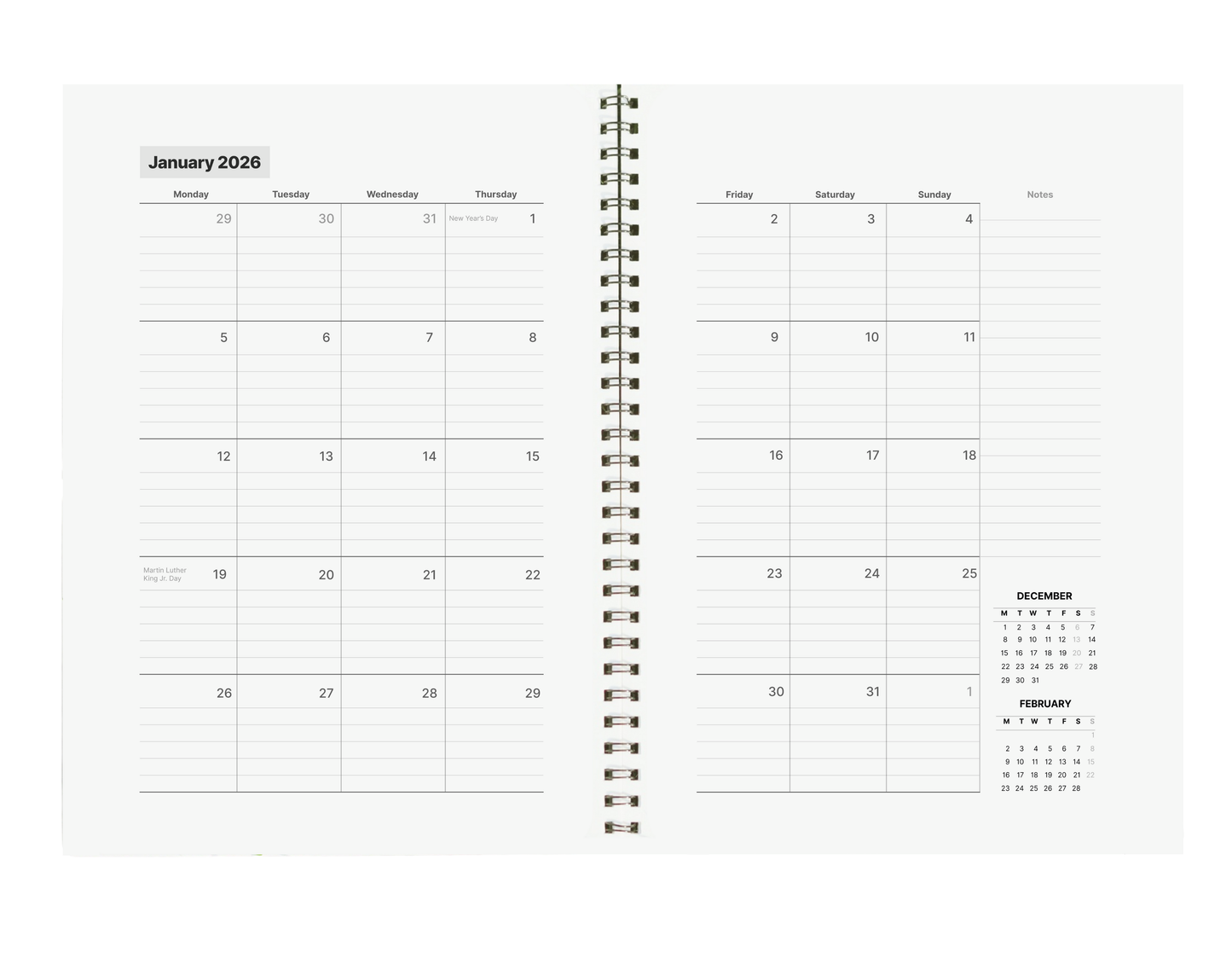 Spiral-bound planner with January 2026 calendar on a white background