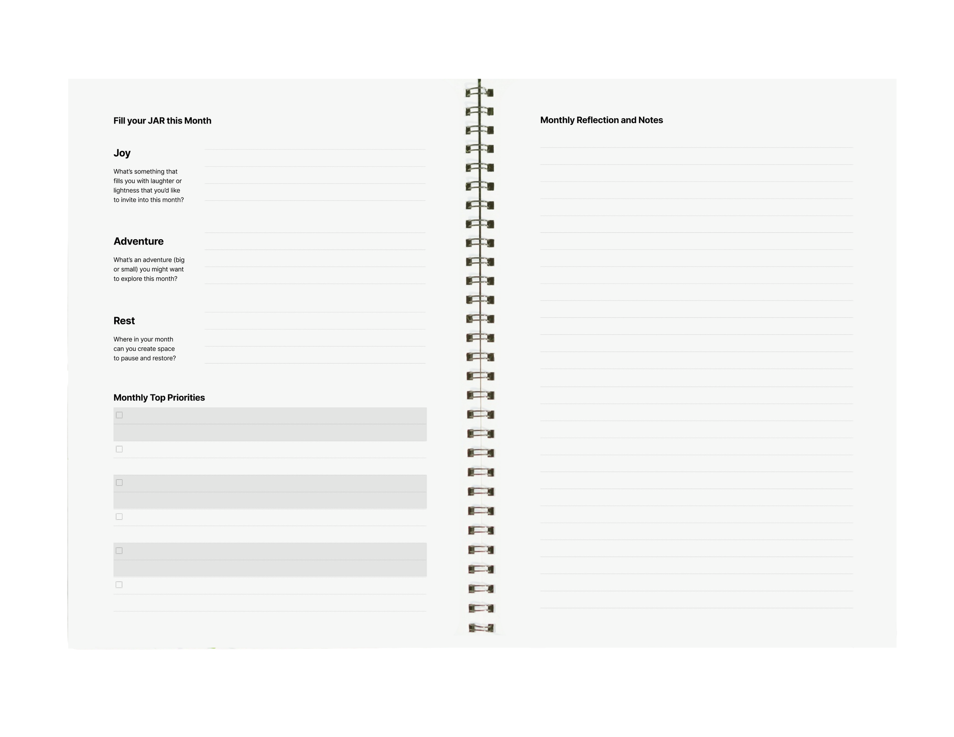 Spiral-bound planner with reflection and notes pages on a white background